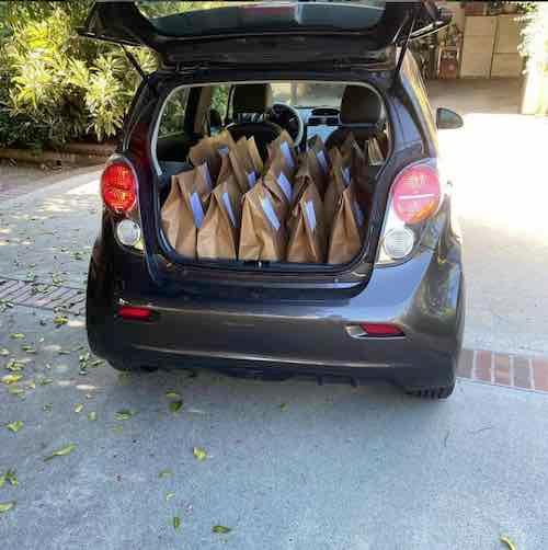 Electric delivery car filled with CSA boxes